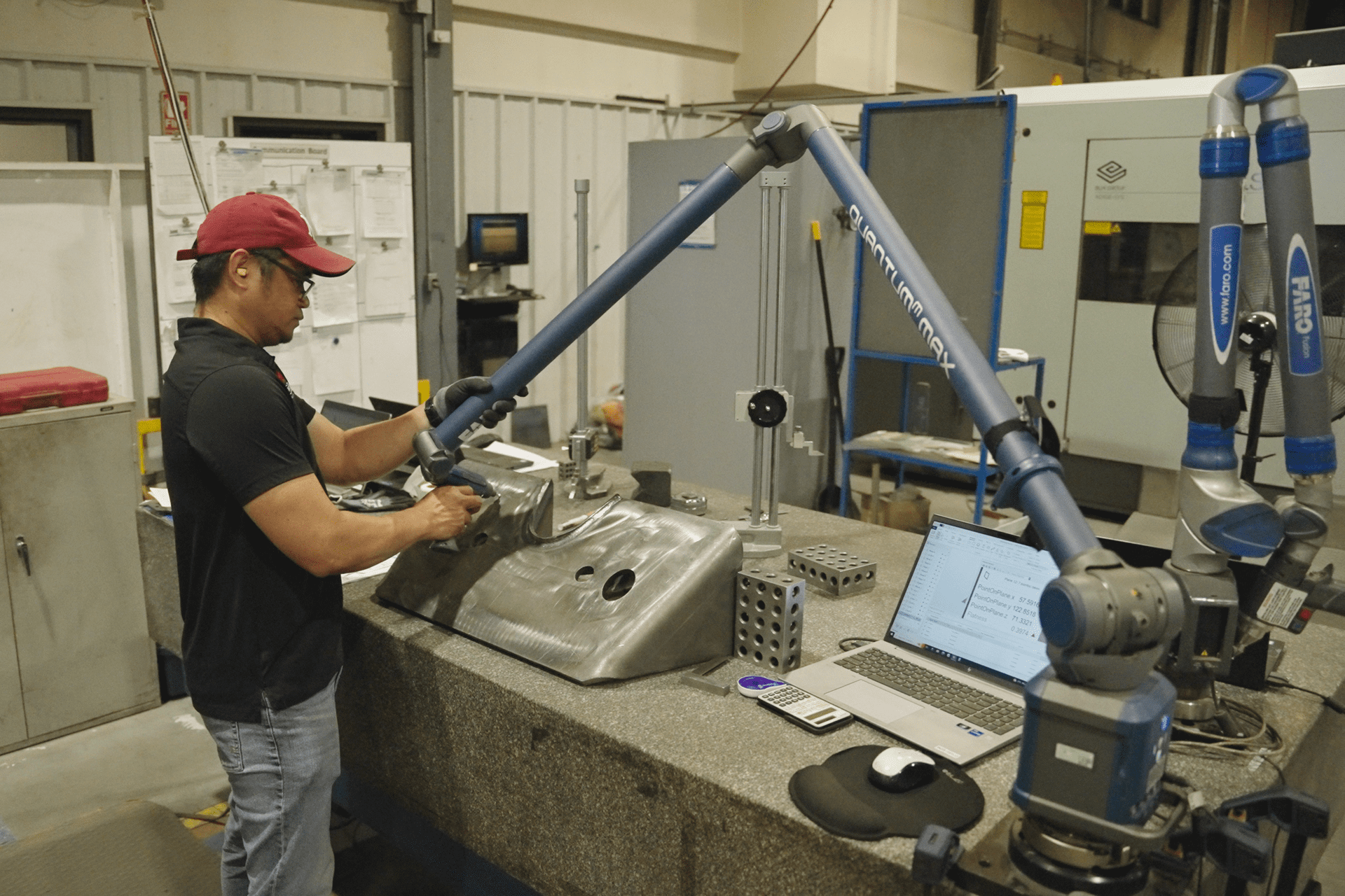quality assurance being checked on part with Faro Arm quality assurance being checked on part with Faro Arm